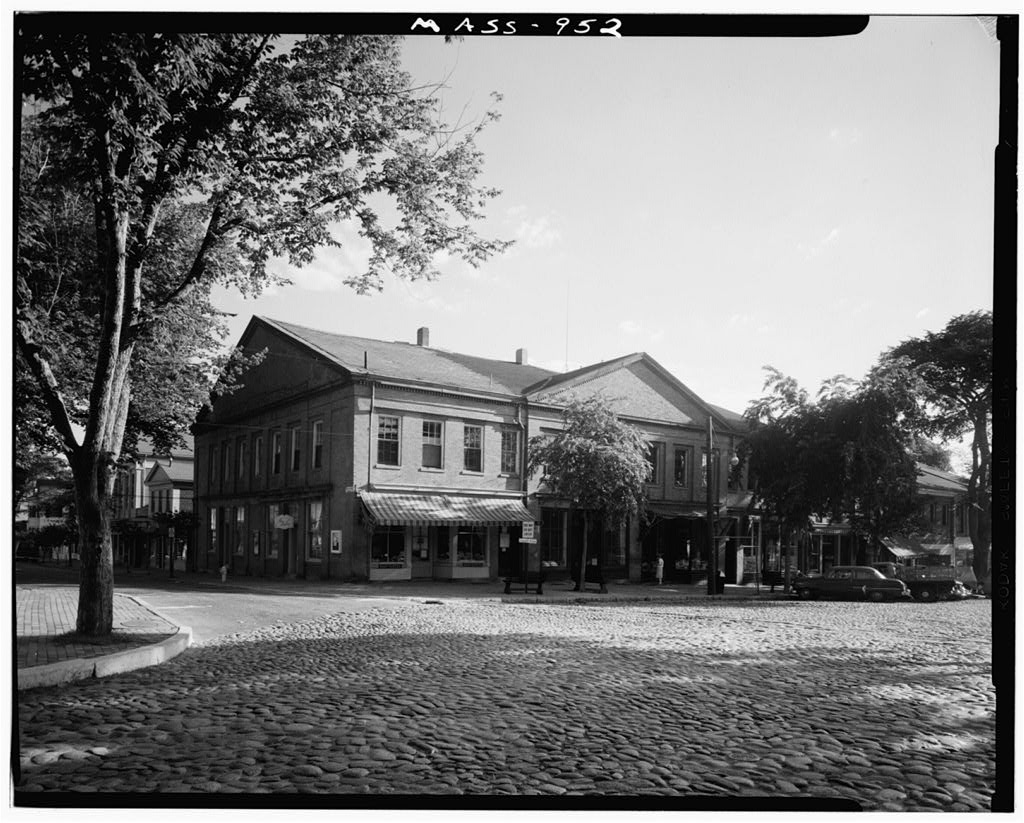 A black-and-white town square lined with storefronts in Nantucket, Massachusetts